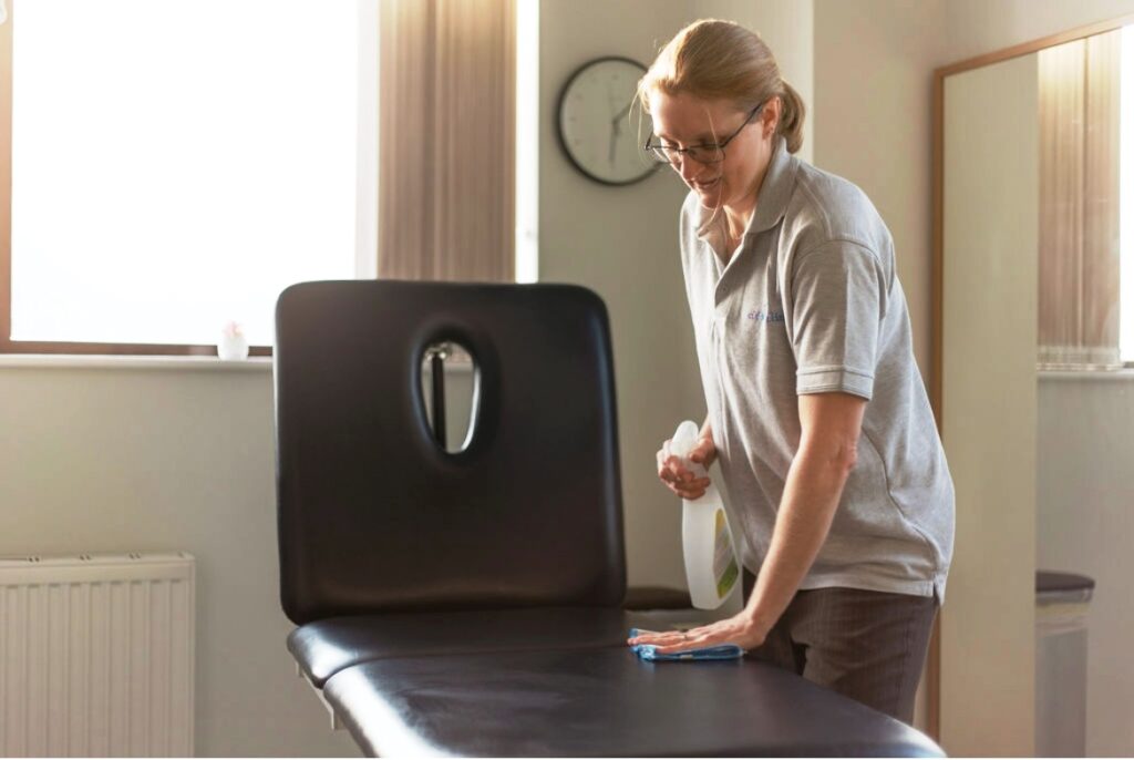 Catherine Fletcher-Liddell preparing the treatment room at CF Foot Clinic Basingstoke