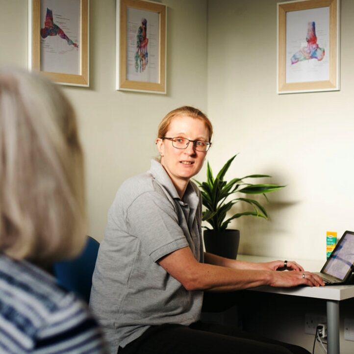 Catherine Fletcher-Liddell welcoming a patient to CF Foot Clinic Basingstoke